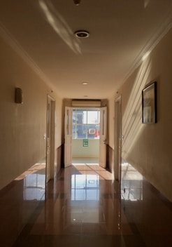a hallway with a glass door