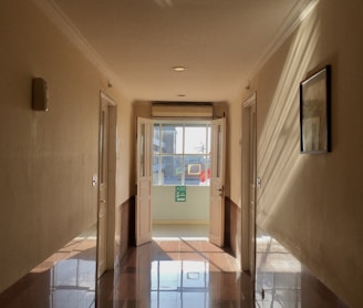 a hallway with a glass door