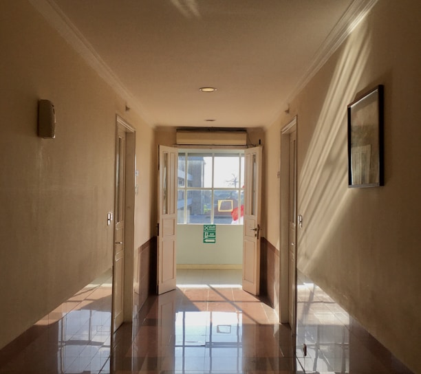a hallway with a glass door