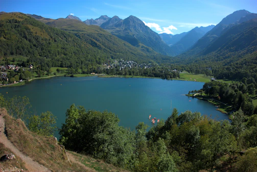 A scenic landscape from one of Yolva's day tours, showing travelers enjoying a peaceful lakeside view.