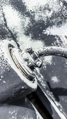 Detail of zinc-rich coating being sprayed on an exterior pipeline surface.