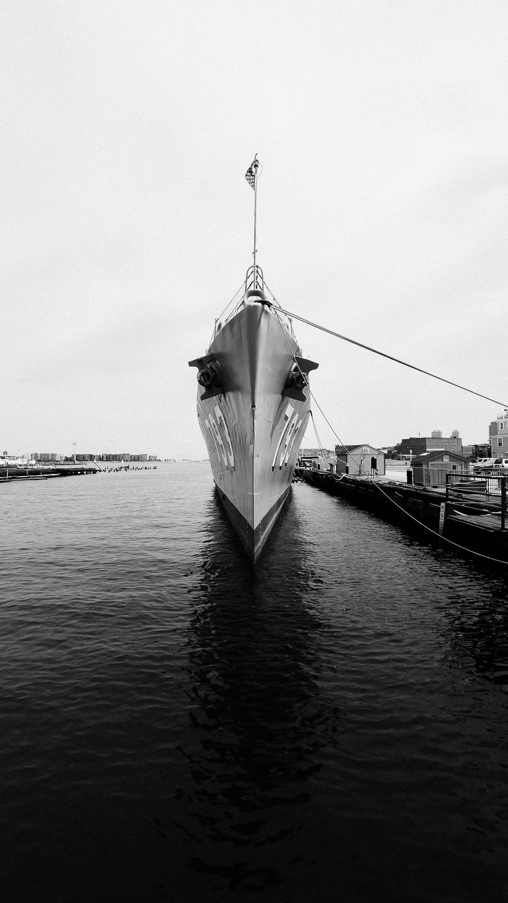 a large white umbrella over a body of water