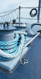 Close-up of strong nautical ropes coiled neatly on a boat deck.