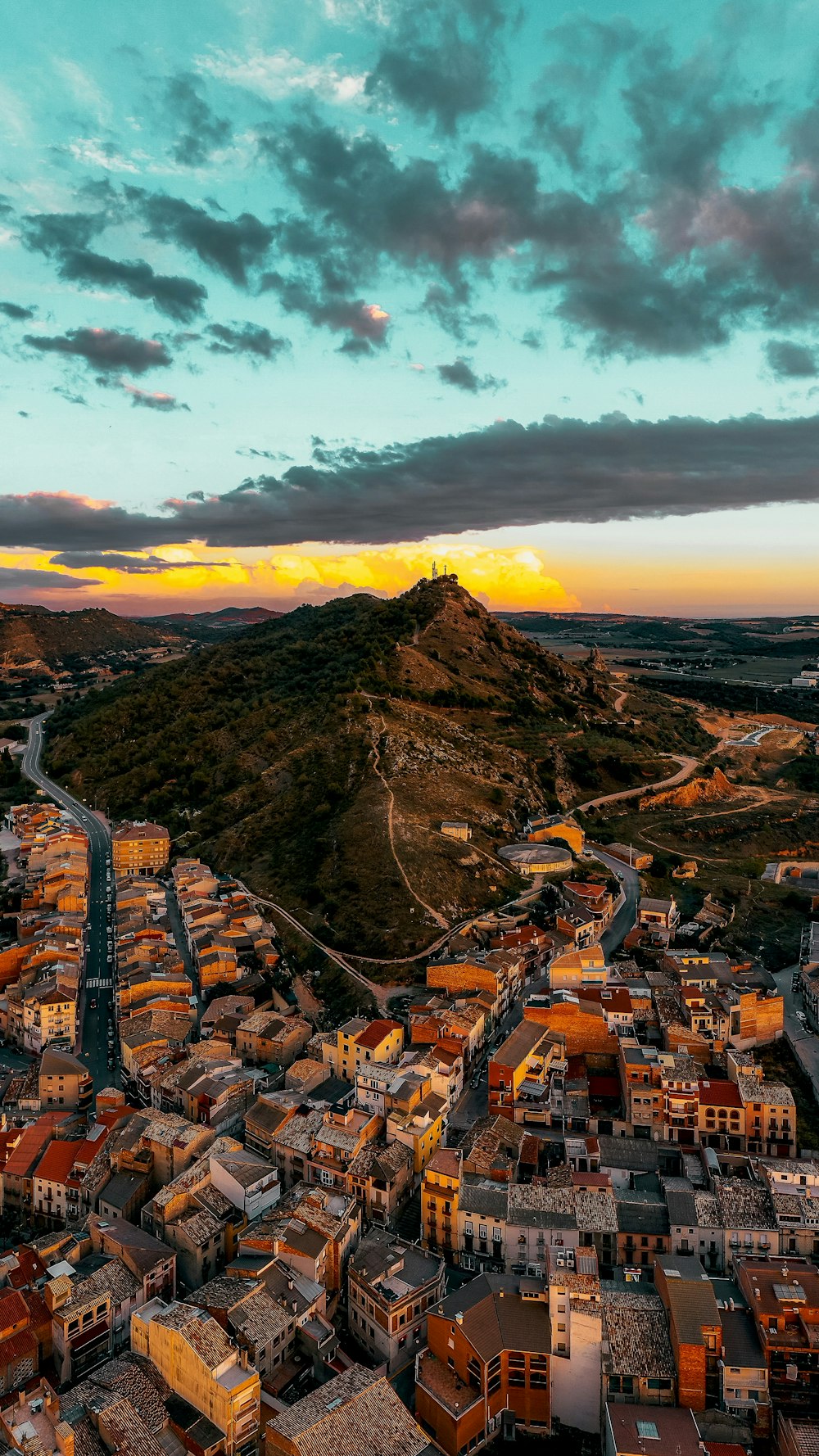 a city with a hill in the background