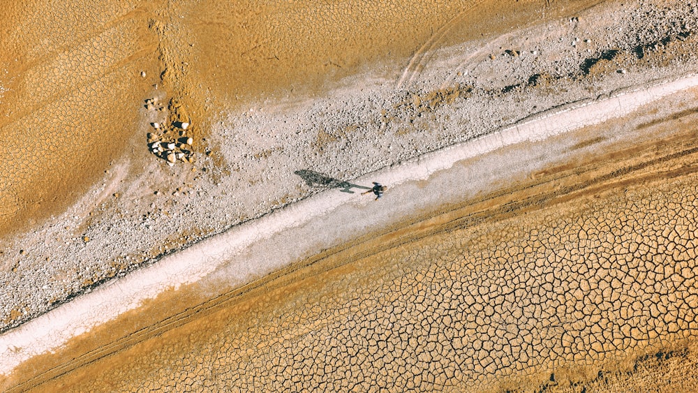 a person riding a motorcycle on a dirt road