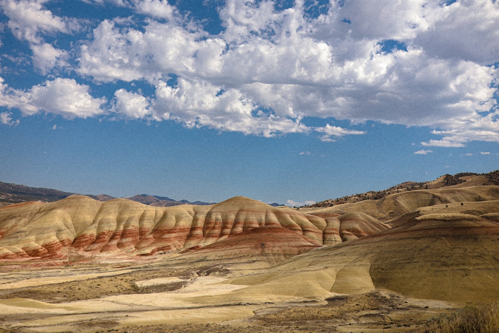 a landscape with hills and clouds