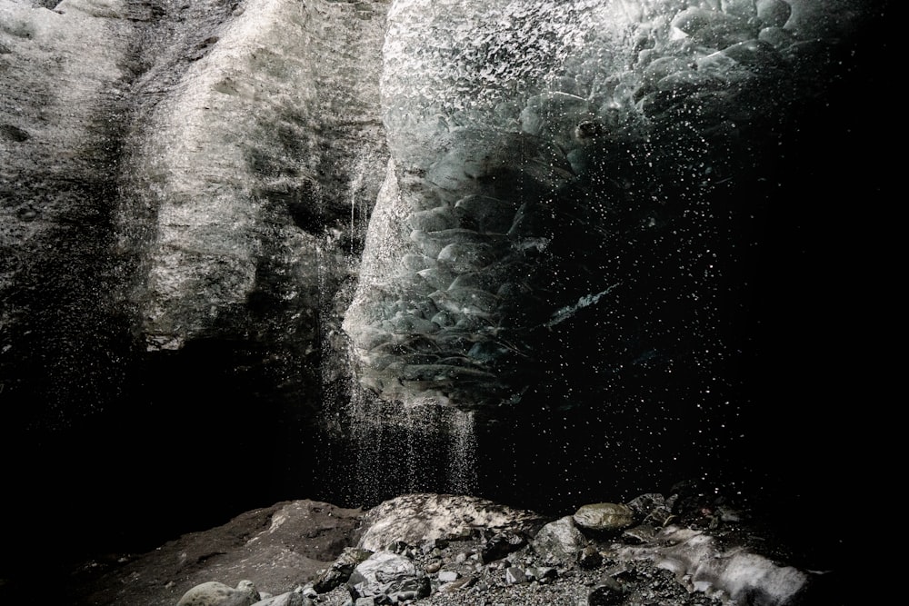 a cave with a waterfall