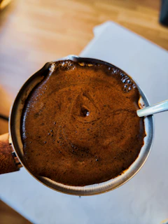Freshly brewed cup of monsoon Malabar with rich crema and steam rising gently.