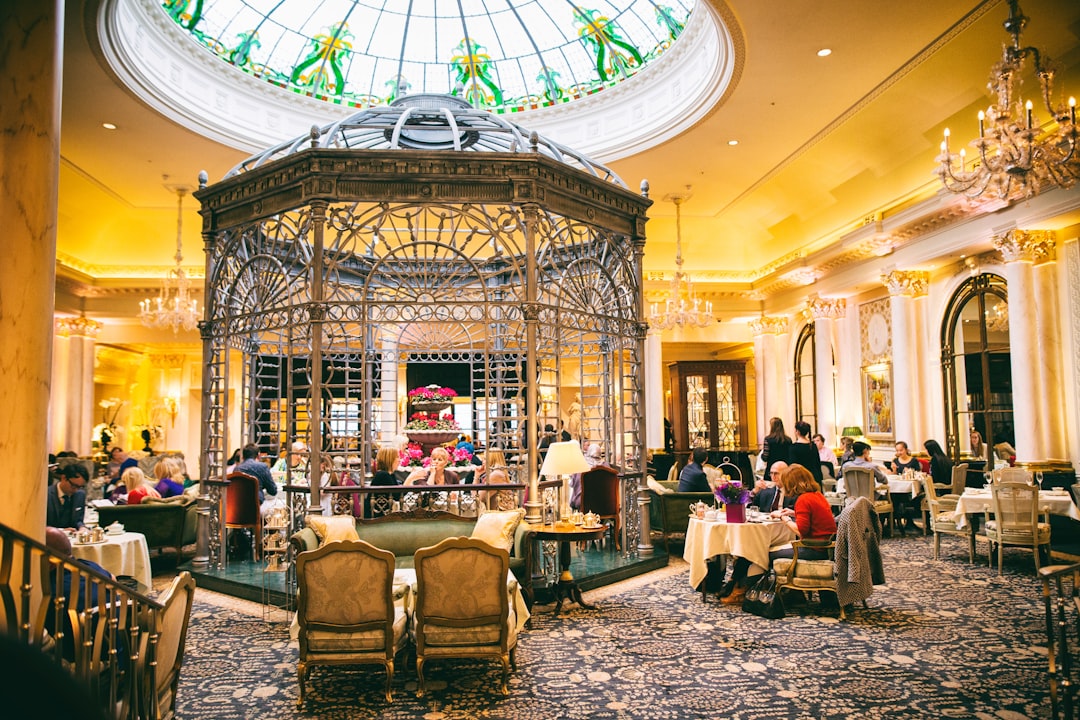 a group of people sitting at tables, Afternoon Tea at The Savoy.