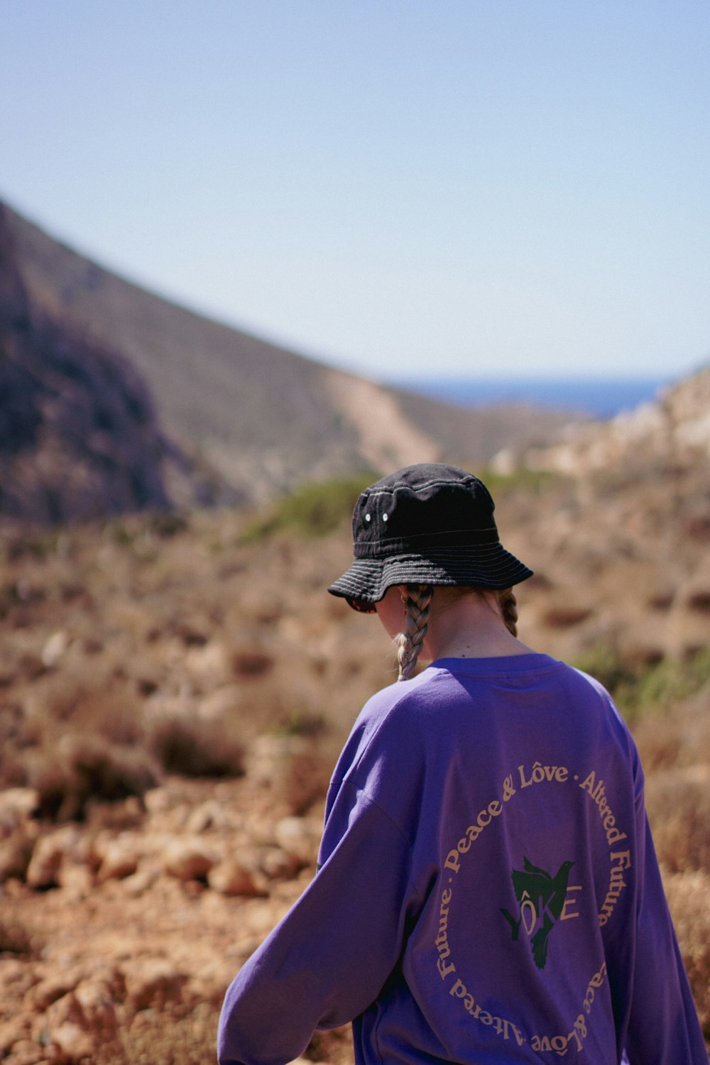 a person walking on a dirt road