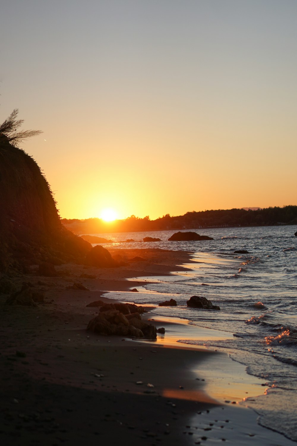 a beach with a sunset