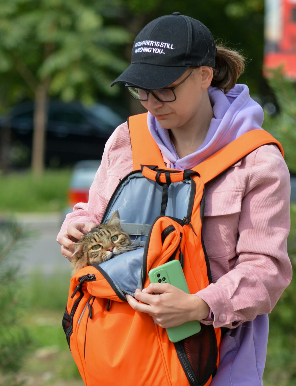 a person with a cat in a backpack