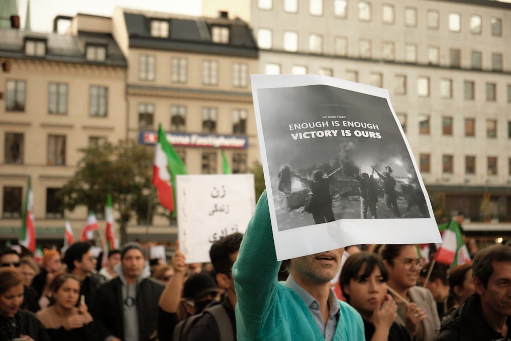 a group of people holding signs