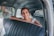 a person sitting in a car