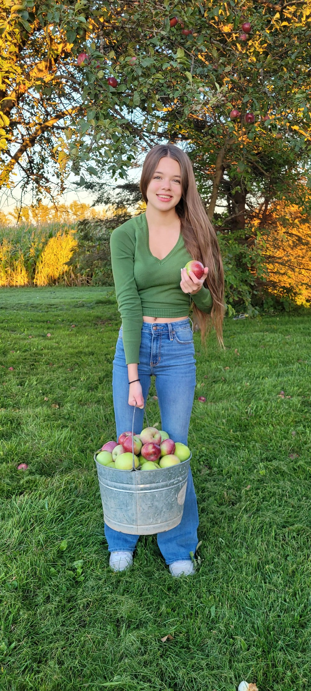 a woman holding an apple