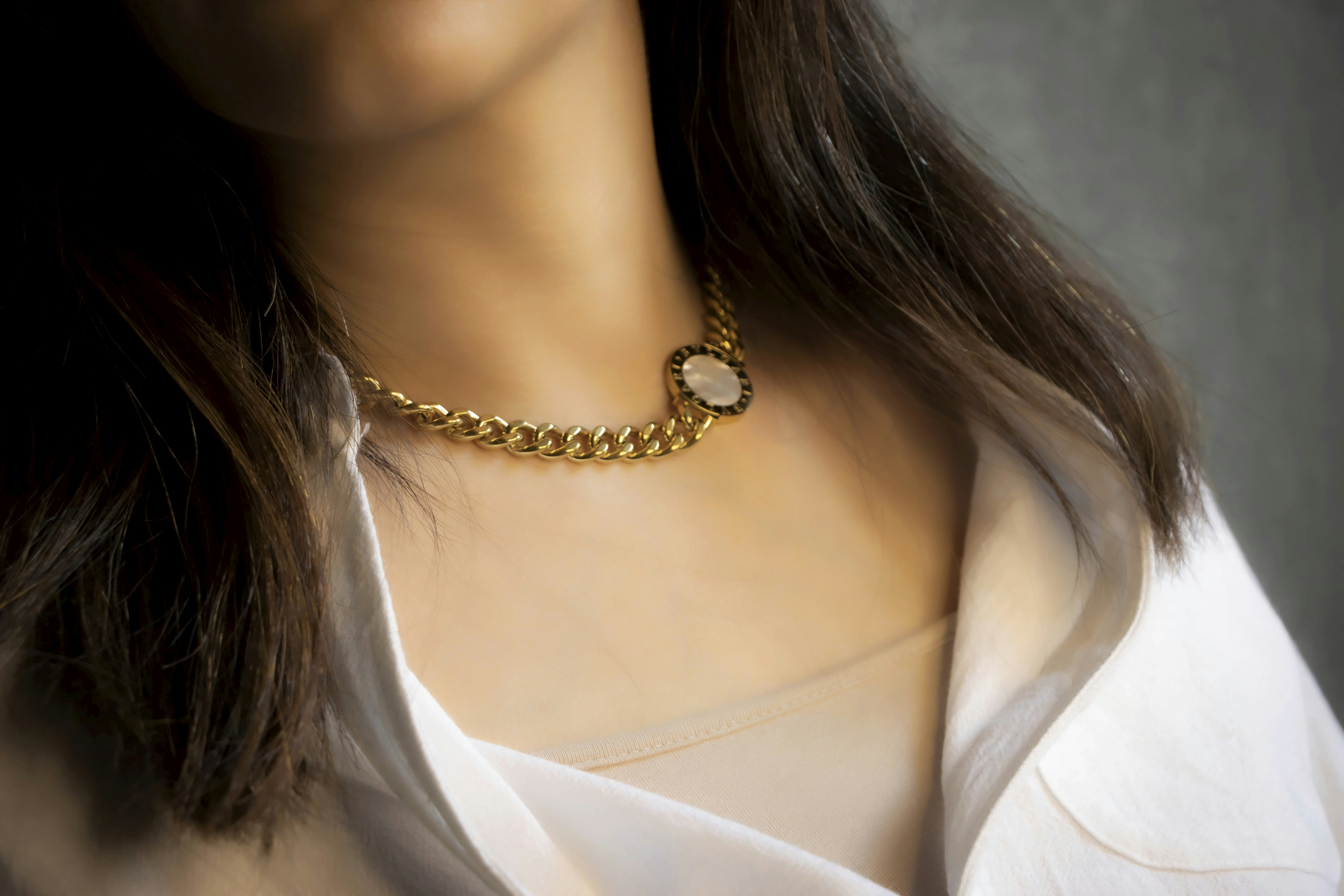 a woman with a necklace