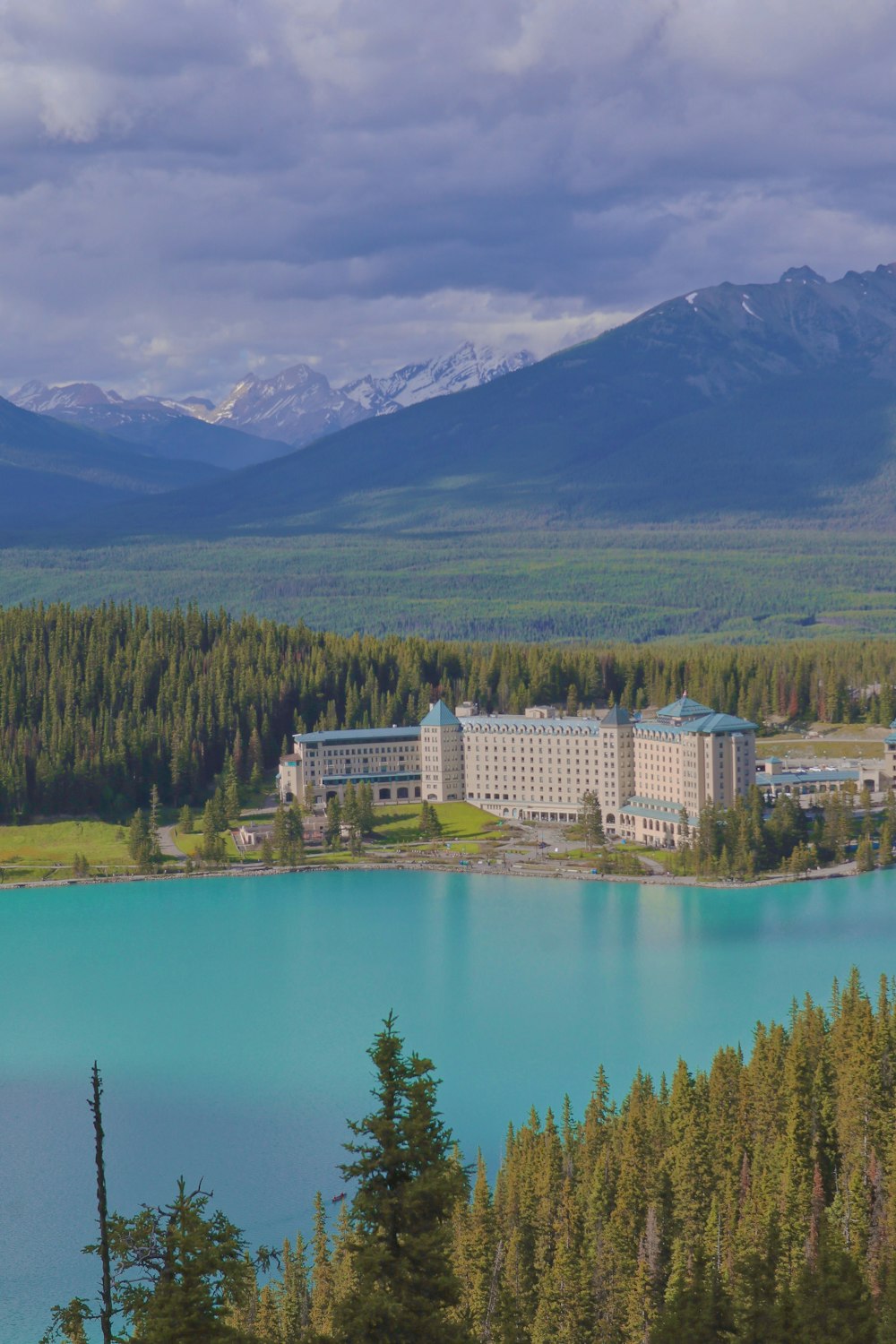 a large building by a lake