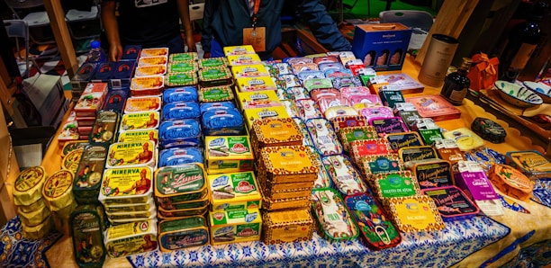 A bustling processing plant showcasing workers carefully canning fresh tuna under bright industrial lights.