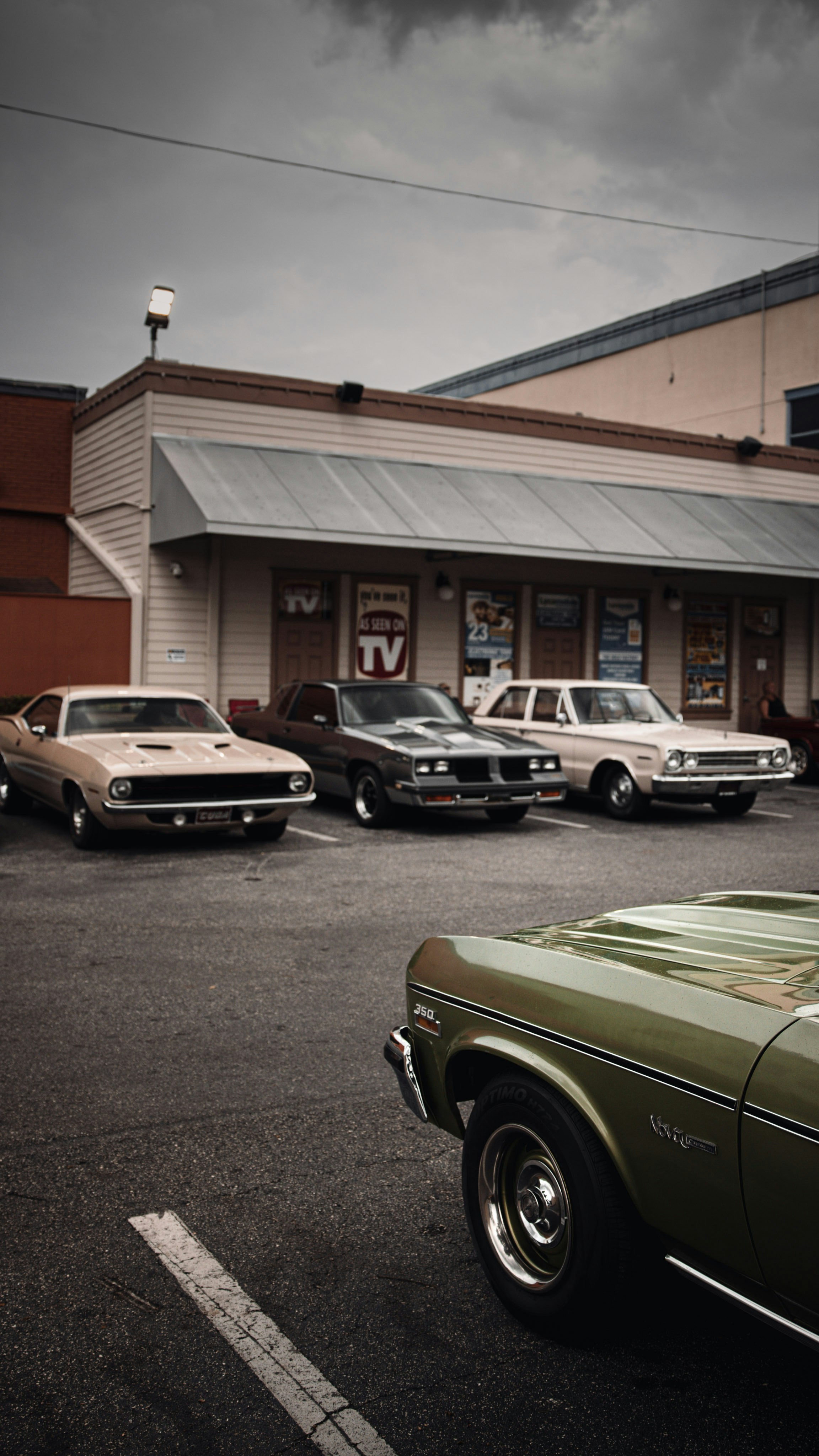 a group of cars parked outside a building