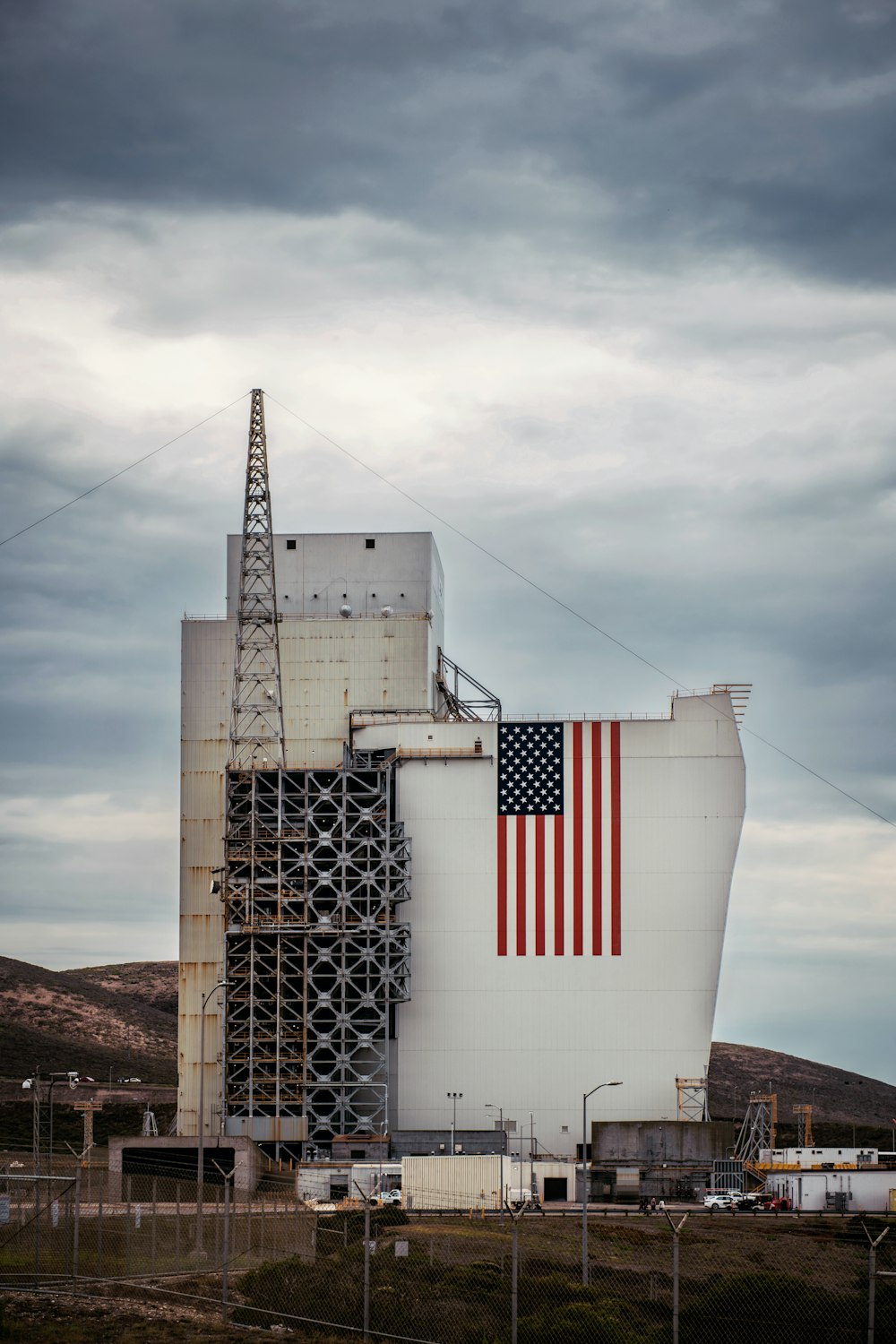 a large white building with a red and blue striped flag