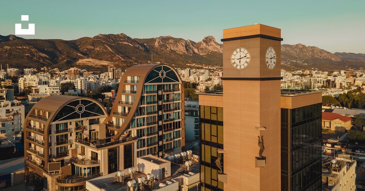 Clock Module Cyprus A clock tower in a city photo – Free Cyprus Image on Unsplash