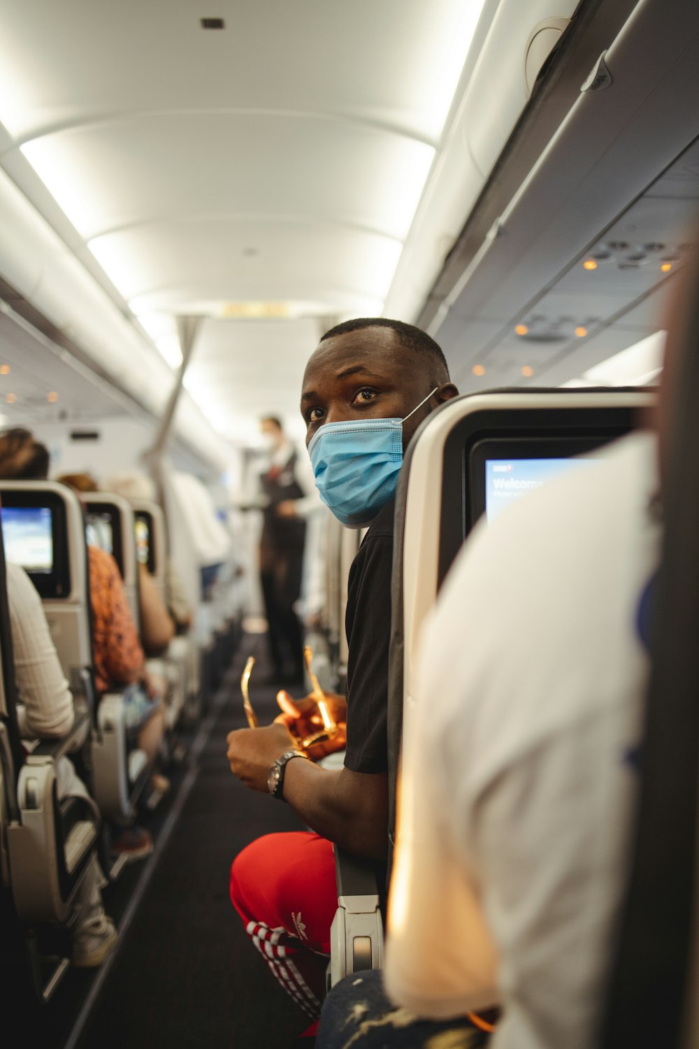 a person in a mask on a plane