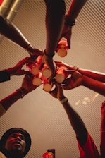 a group of people holding hands