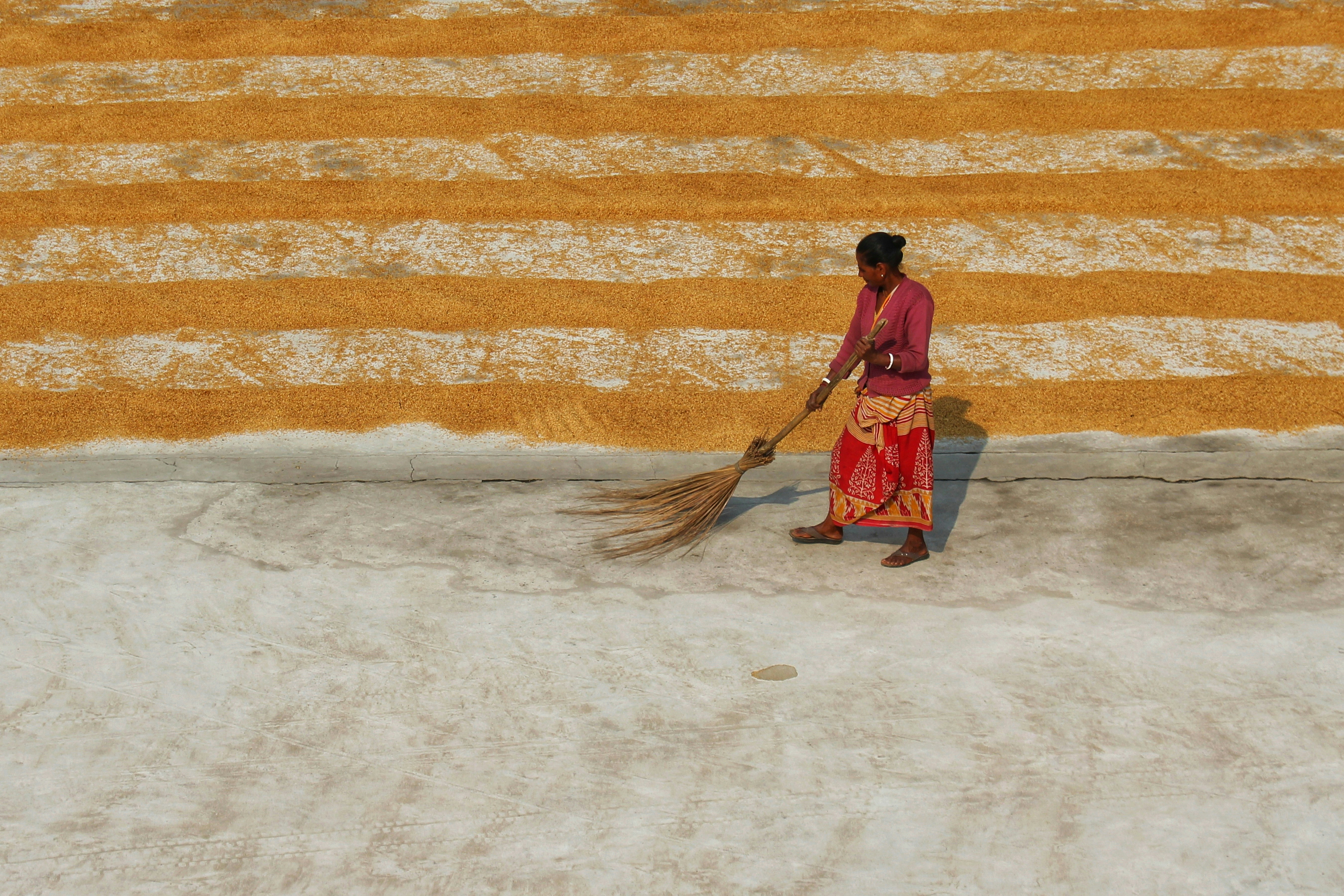 a man holding a broom