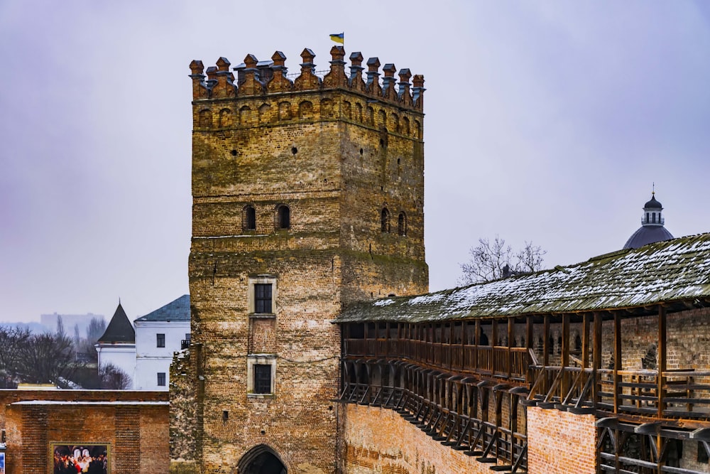 a stone tower with a group of people on top