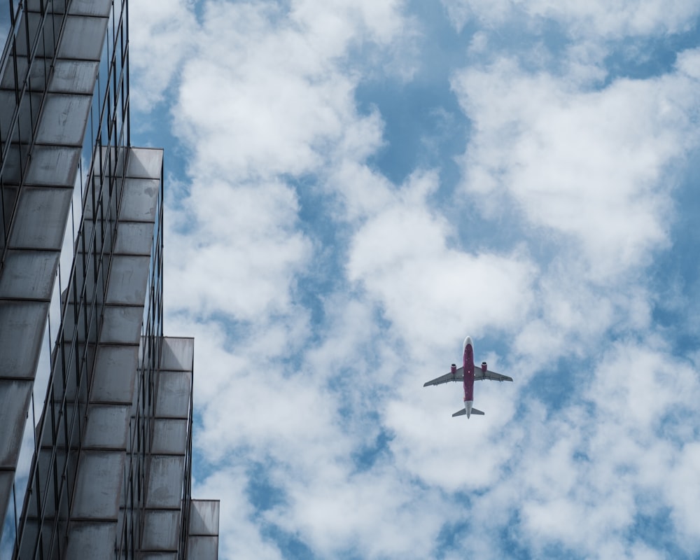 an airplane flying over a building