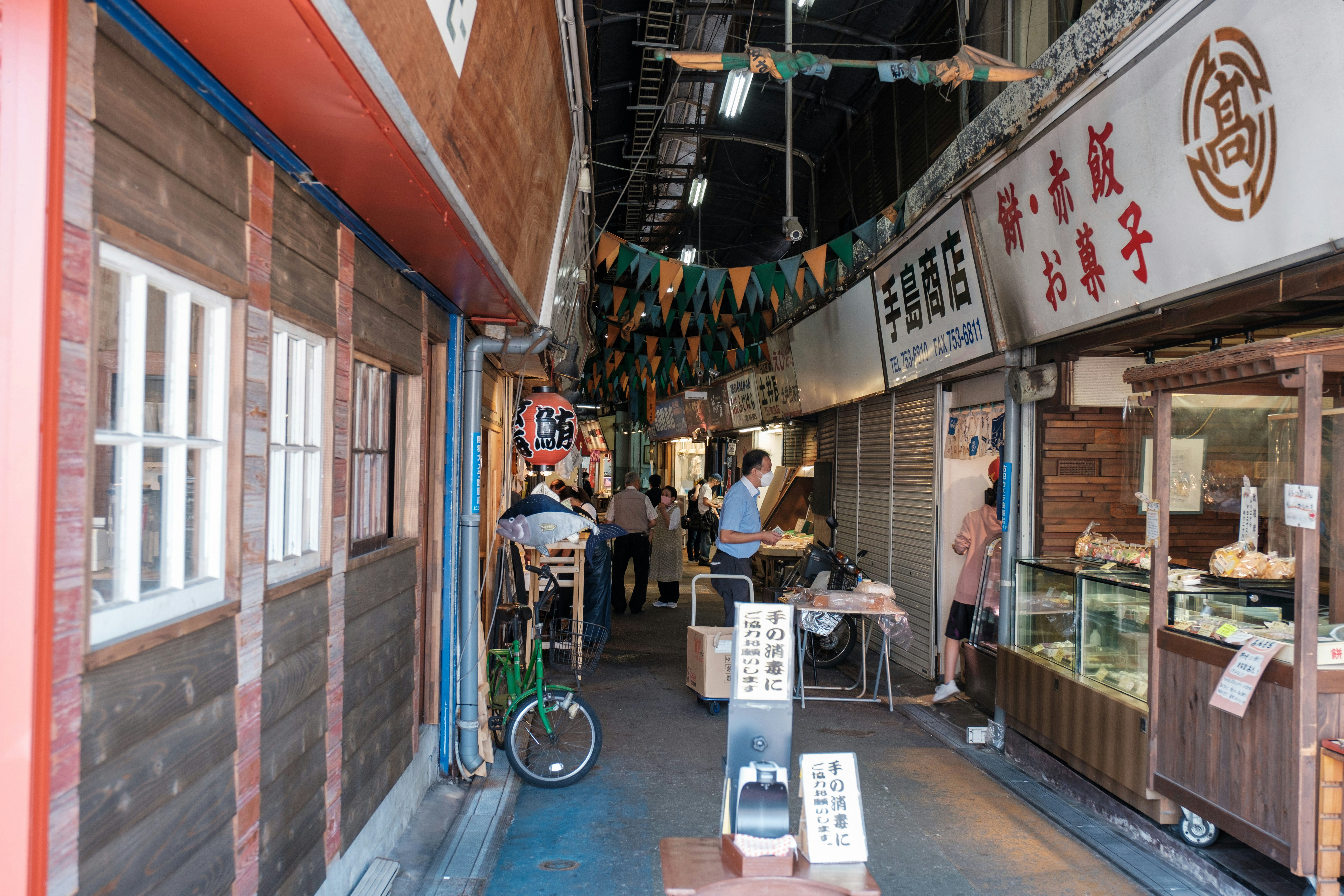 a group of people stand outside a restaurant, 