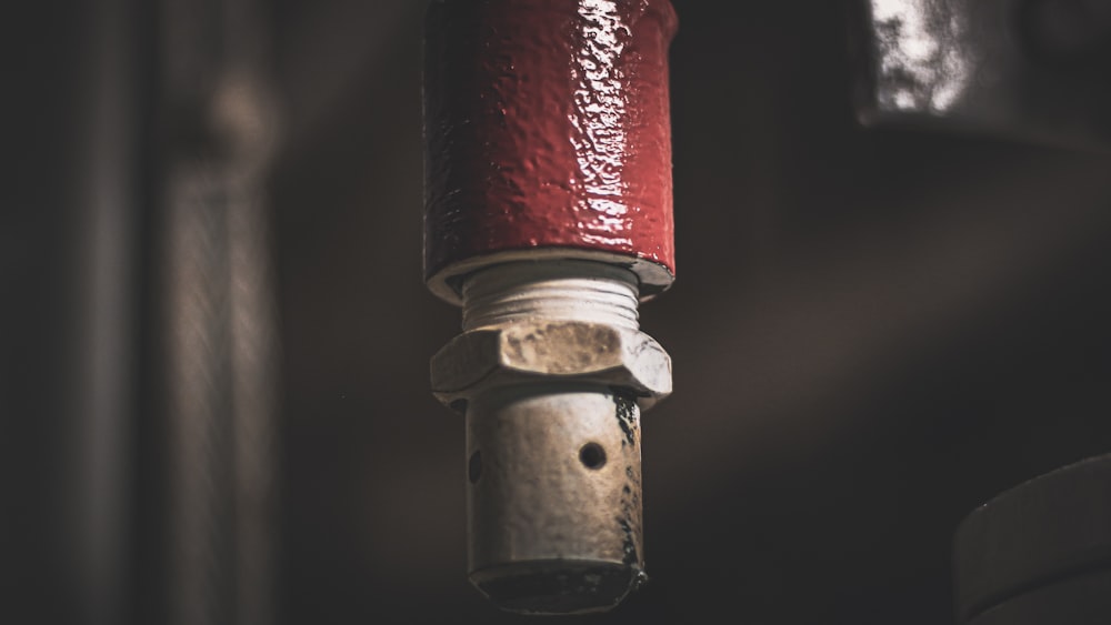 a fire hydrant with a red and white top