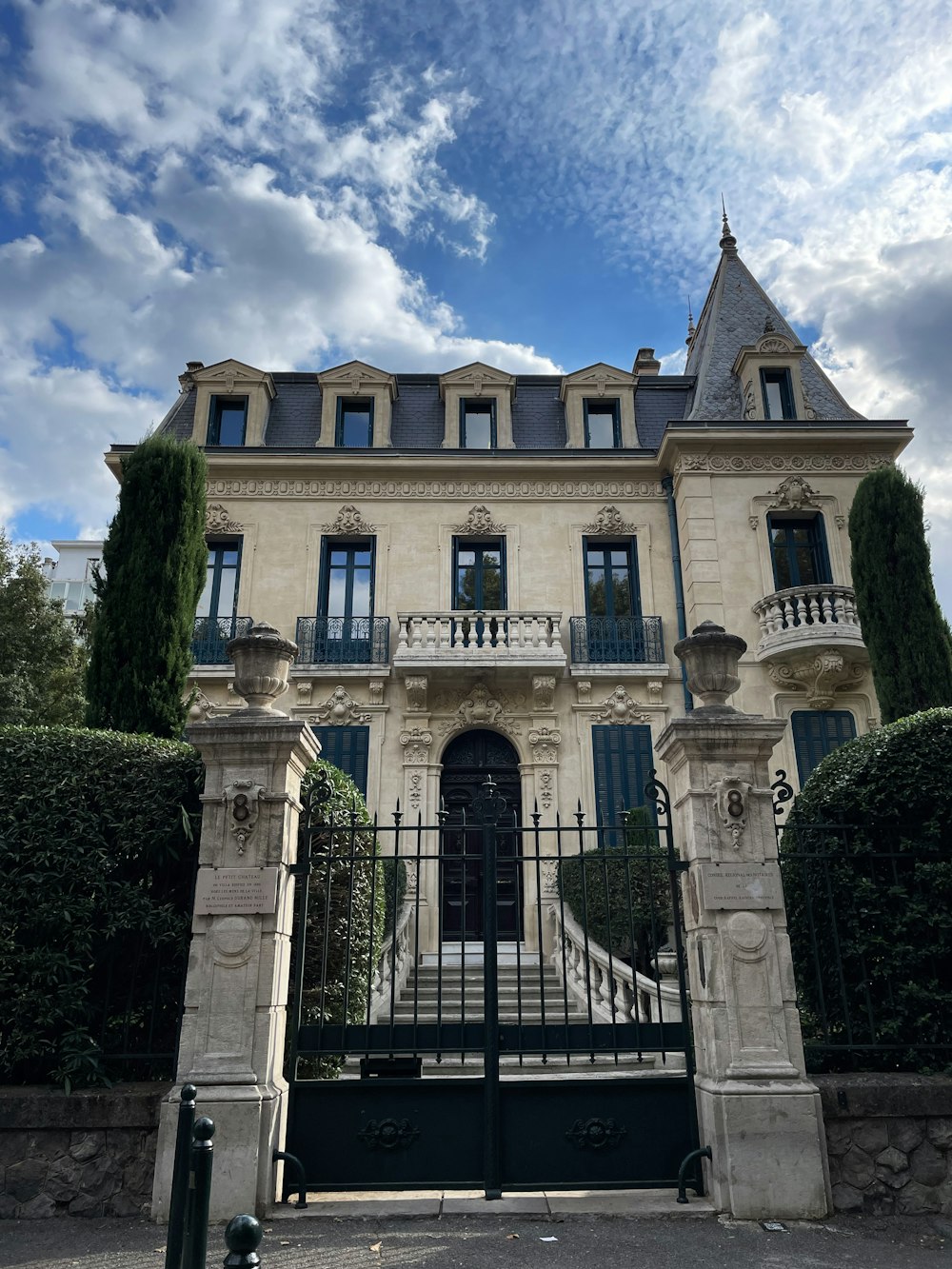 a large stone building with a gate