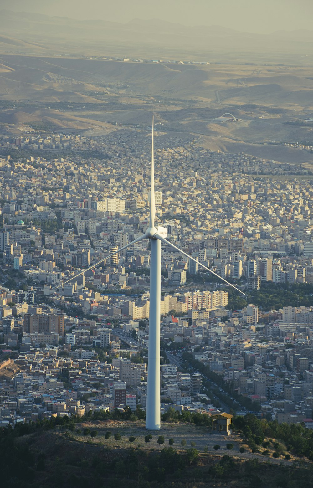 a large white tower in a city