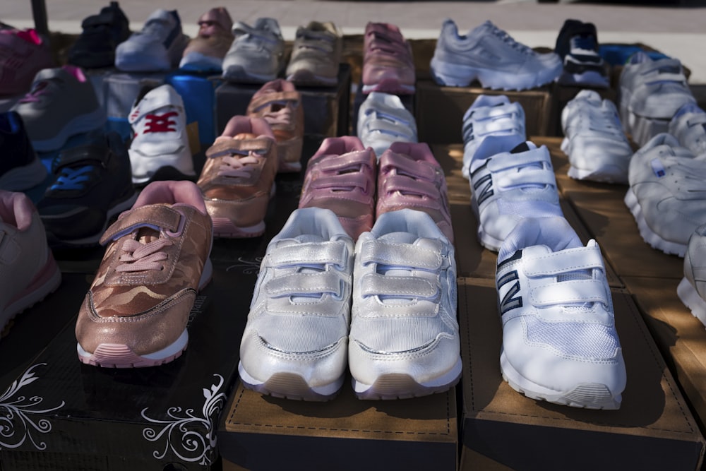 a person lying on a shelf with shoes on it