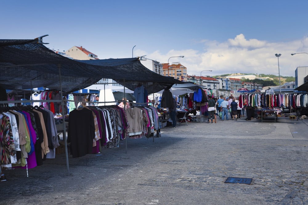 a group of people at an outdoor market