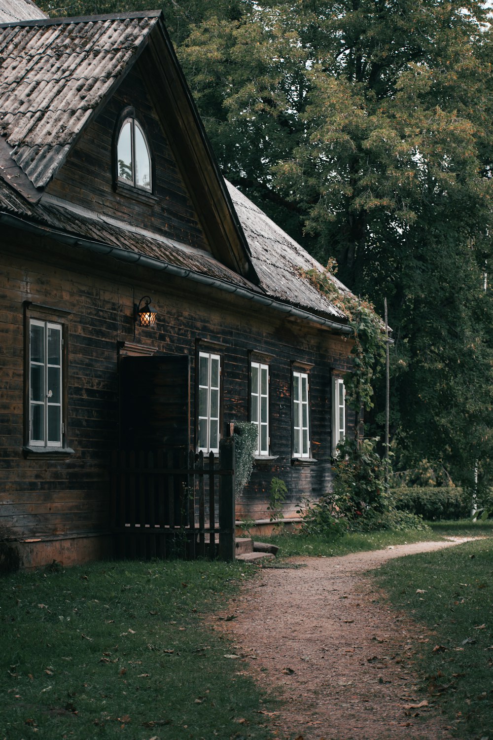 a wood house with a fence