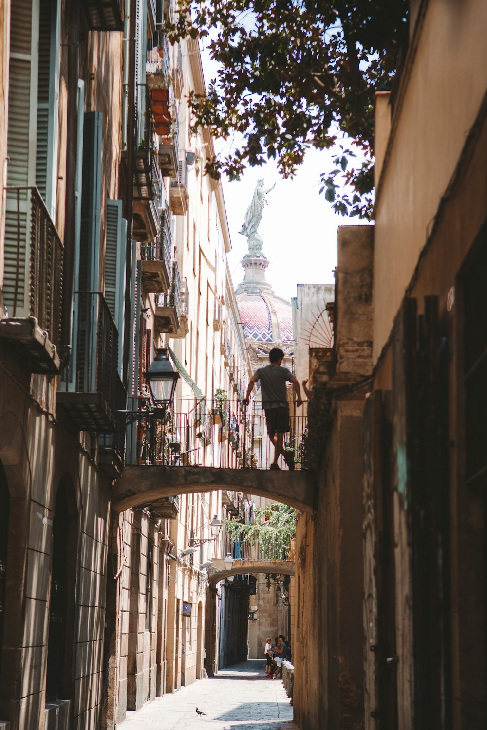 a person walking down a narrow street