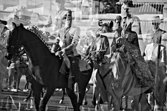 a group of men riding horses