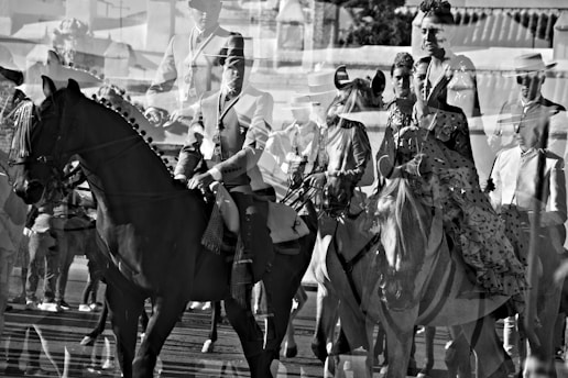a group of men riding horses