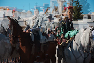 a group of people riding horses