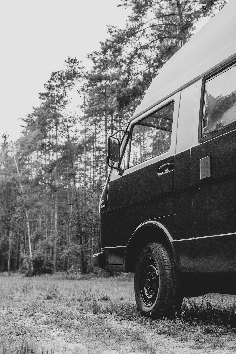 a black van parked in a field