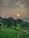 A serene landscape features a lush green field in the foreground, bordered by trees. In the background, the sun sets with a soft glow against a cloudy sky. Rolling hills and wind turbines are faintly visible in the distance, hinting at sustainable energy use.