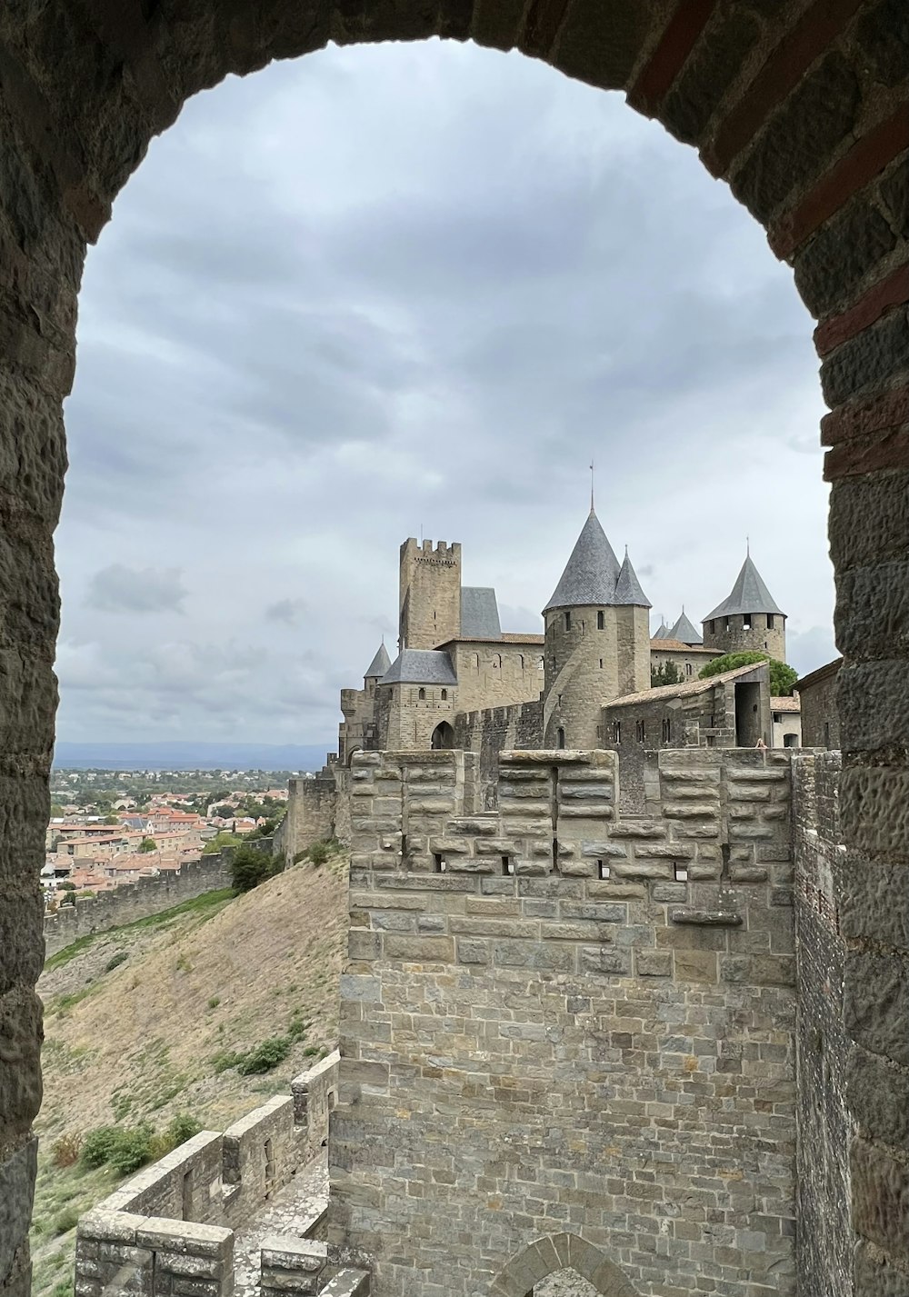 a stone building with towers