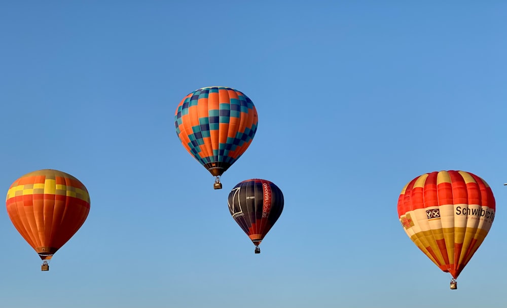 a group of hot air balloons in the sky