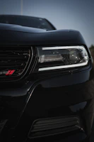 Close-up of a glossy black Astra 2007 front with premium sports detailing.