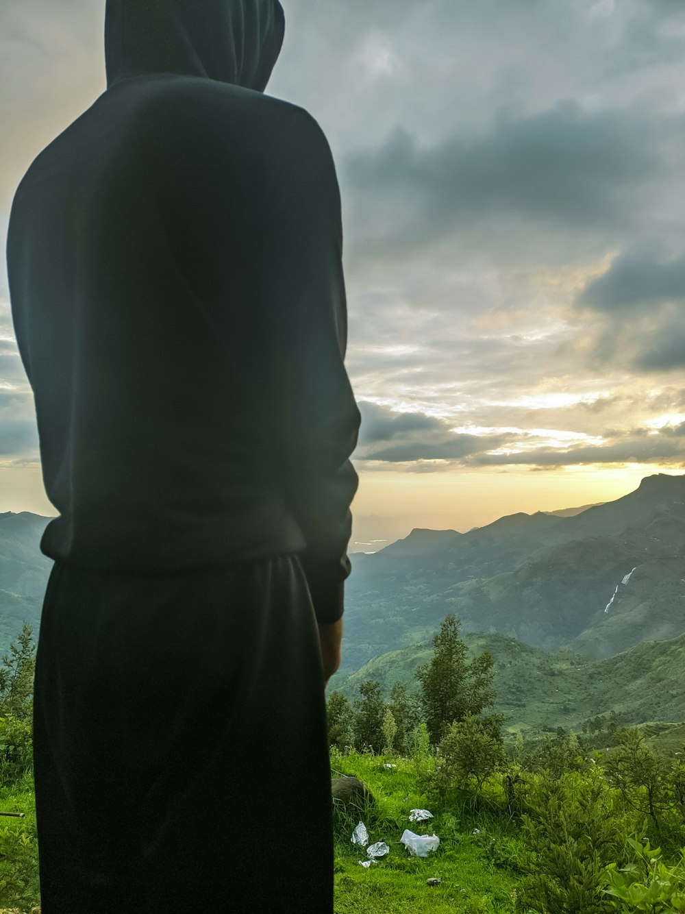 a person standing on a hill