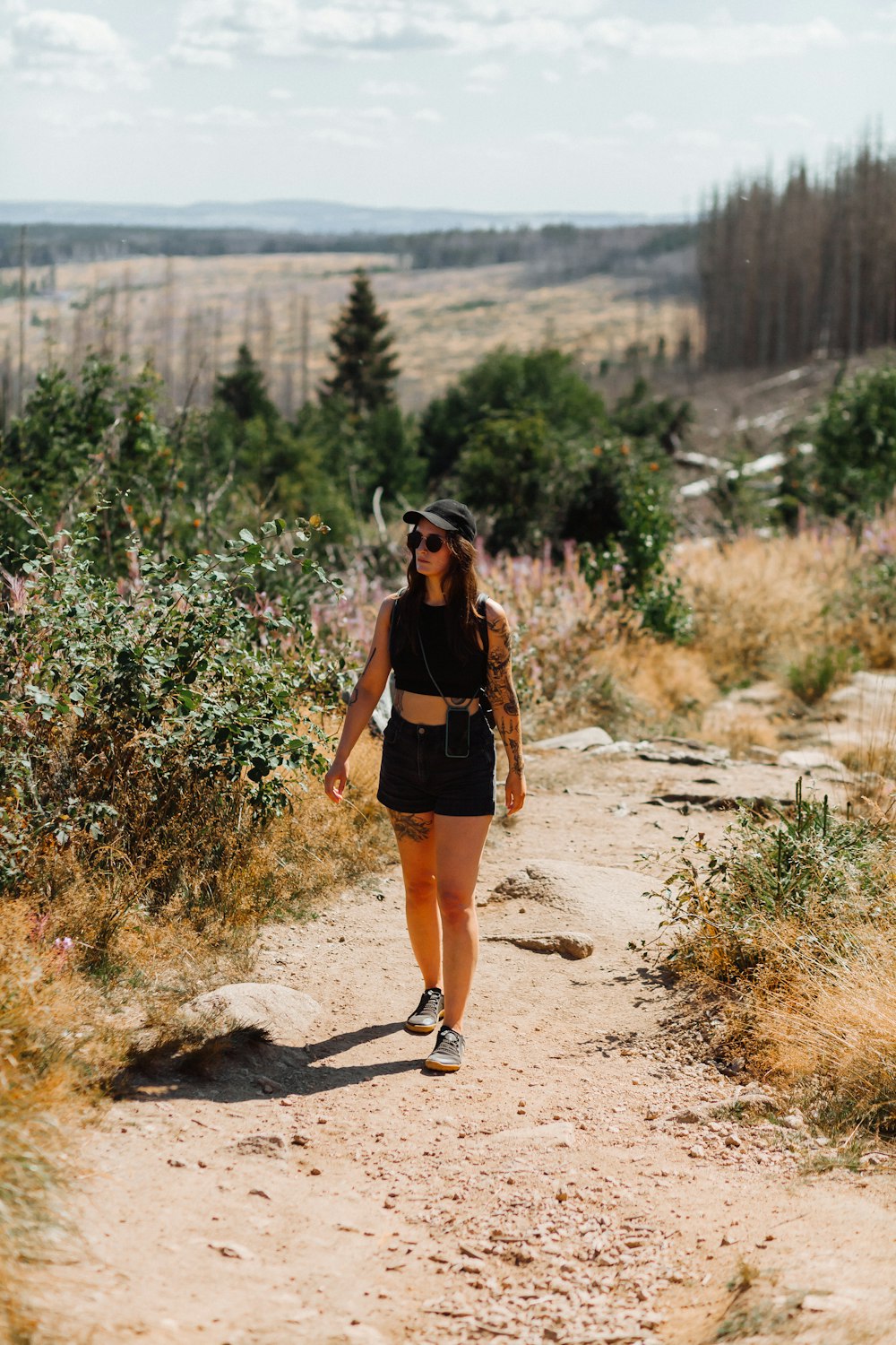 a person walking on a dirt path