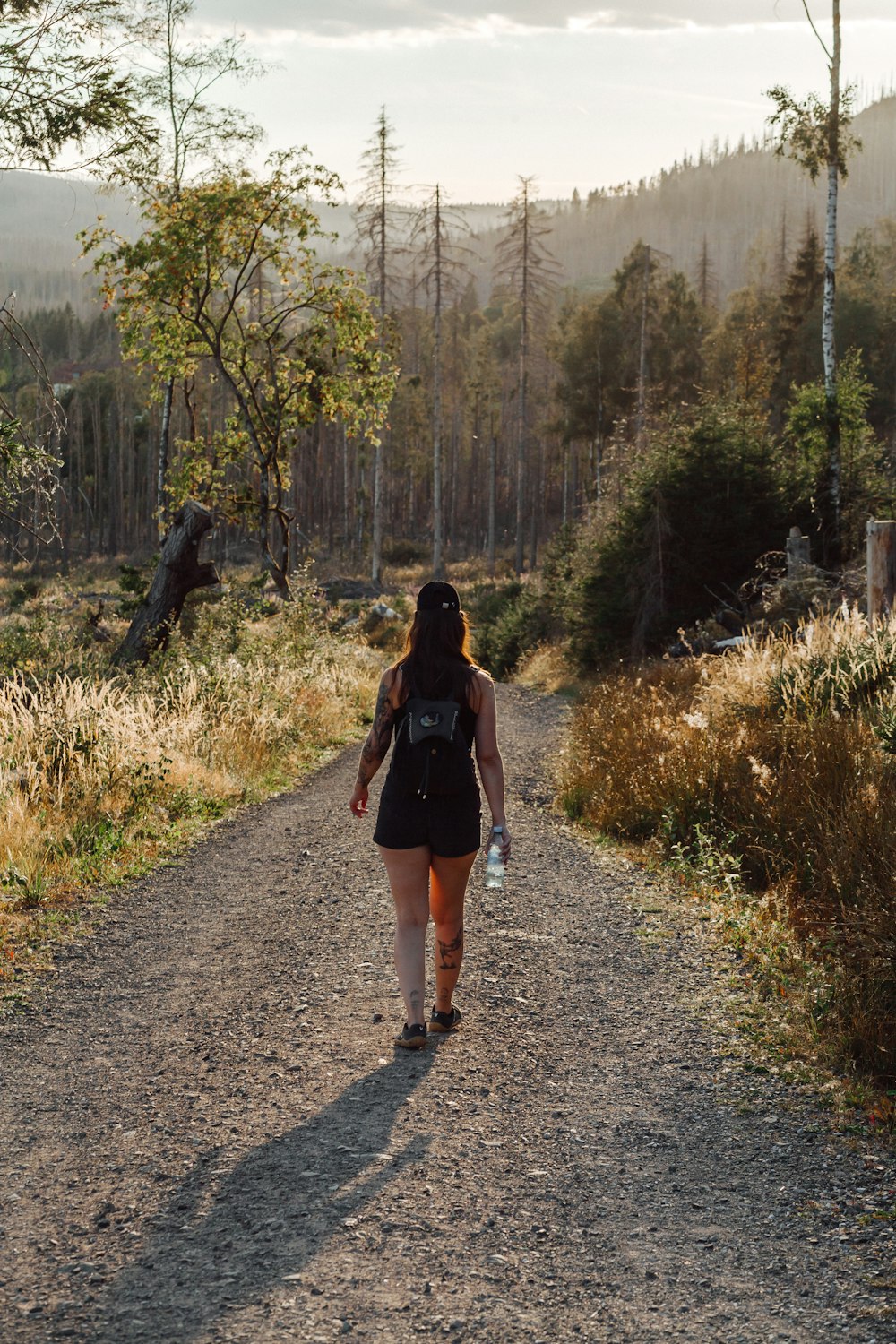 a person walking on a dirt path