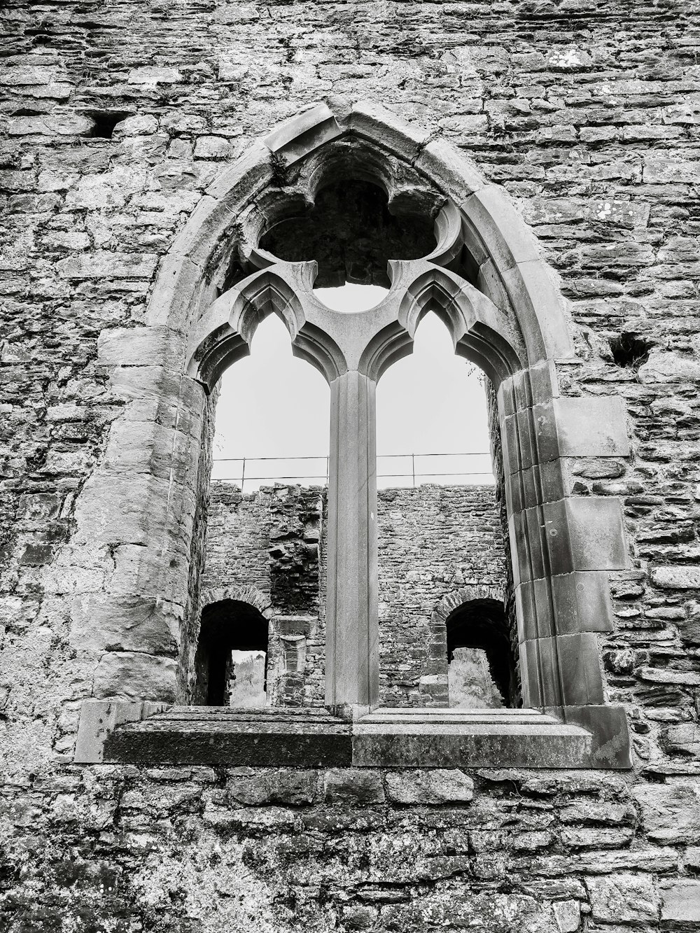 a stone building with a large archway